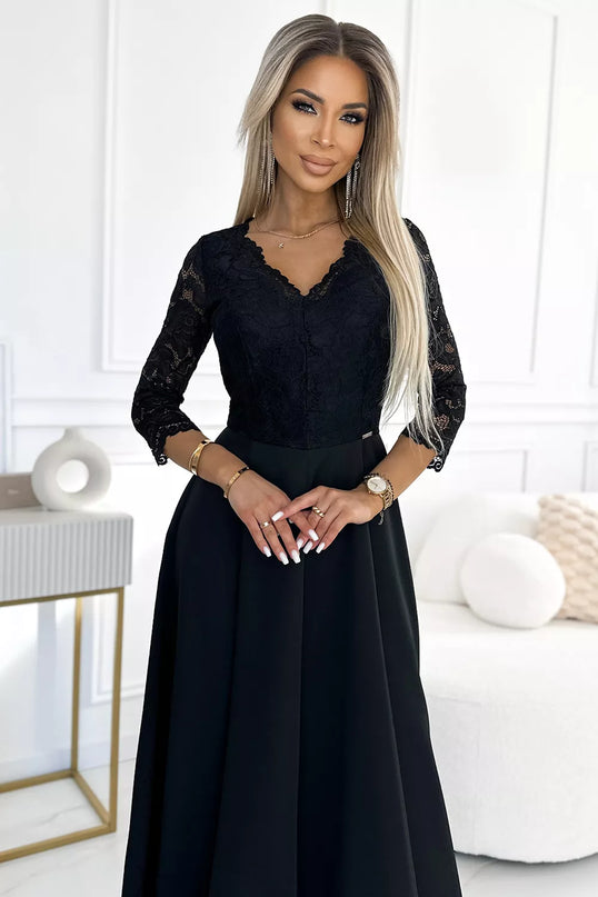 309-11 AMBER nėriniuota, elegantiška ilga suknelė su iškirpte ir kojos skeltuku – juoda