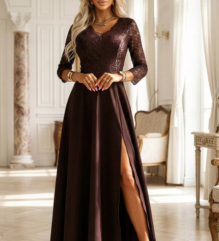 309-14 AMBER Elegantiška ilga nėriniuota suknelė su skeltuku – šokoladinė