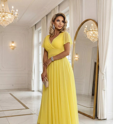 562-8 NASTIA ilga suknelė su iškirpte, raišteliu ir trumpomis rankovėmis – citrininė Limoncello